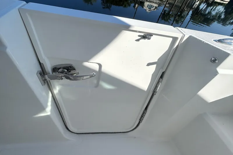  Yacht Photos Pics 2023 Tiara Yachts 38 LS boat door with chrome handle, dockside view.