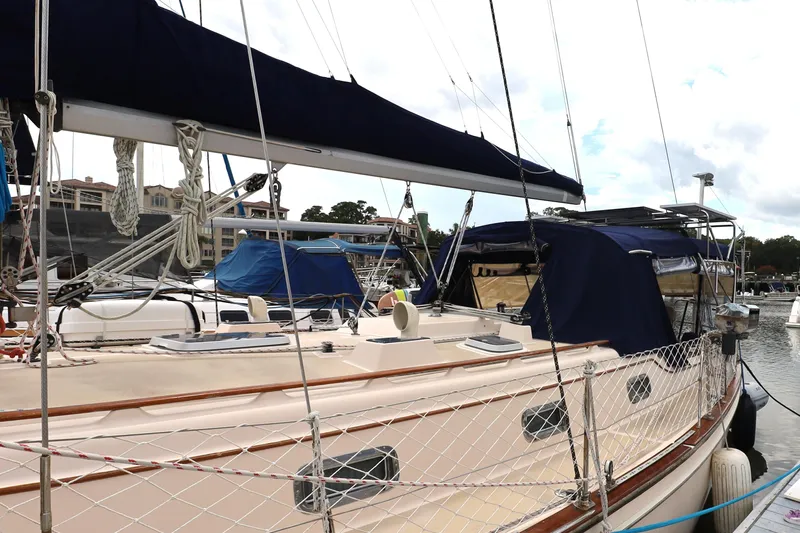 Carpe Diem Yacht Photos Pics Sailboat Island Packet 40, 1995 model, docked at marina with blue canvas covers.