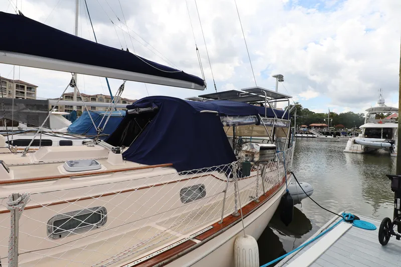 Carpe Diem Yacht Photos Pics Sailboat docked at marina, Island Packet 40, 1995 model, with blue covers.