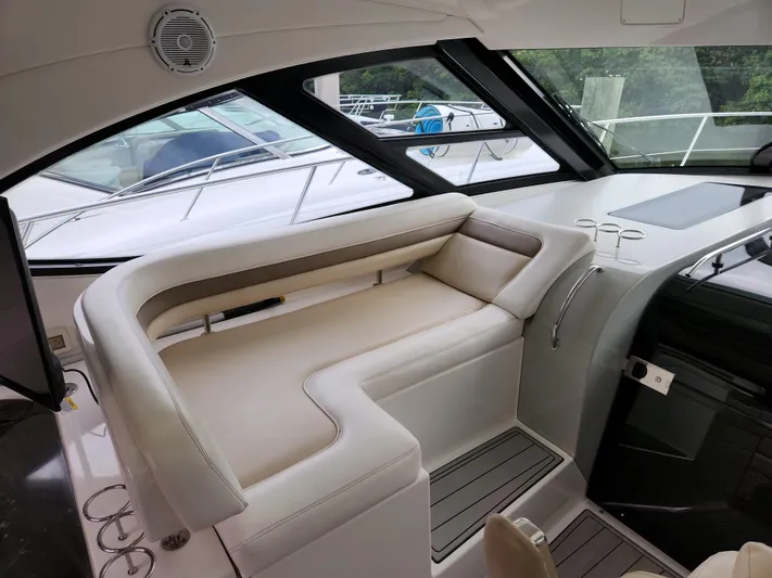Moonwake Yacht Photos Pics Interior seating of 2014 Sea Ray 470 Sundancer yacht, featuring luxurious beige upholstery.