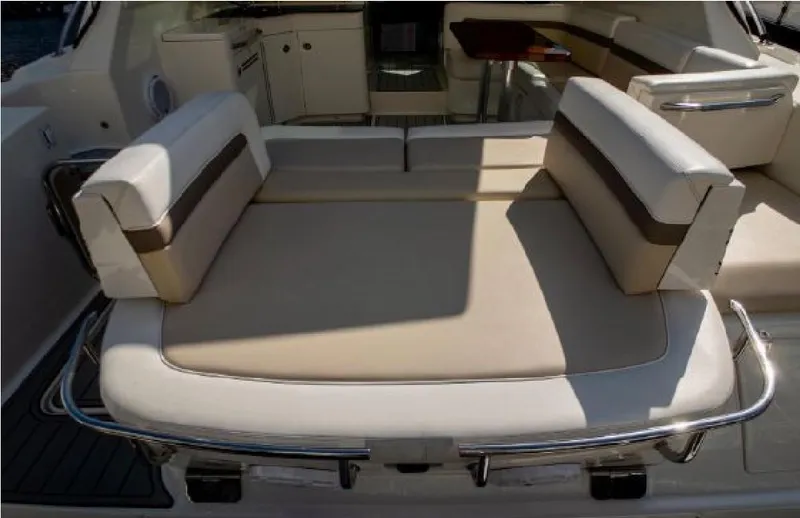 Moonwake Yacht Photos Pics 2014 Sea Ray 470 Sundancer yacht interior with beige seating and stainless steel accents.