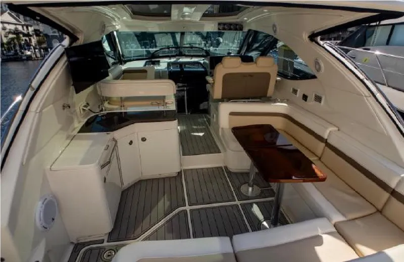 Moonwake Yacht Photos Pics Luxurious interior of 2014 Sea Ray 470 Sundancer yacht with seating and kitchenette.
