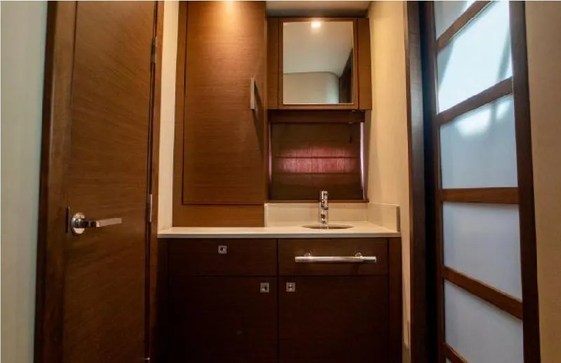 Moonwake Yacht Photos Pics Luxurious bathroom interior of 2014 Sea Ray 470 Sundancer yacht with wooden cabinetry.