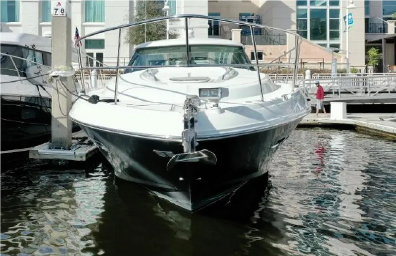 Moonwake Yacht Photos Pics 2014 Sea Ray 470 Sundancer yacht docked at marina, front view.