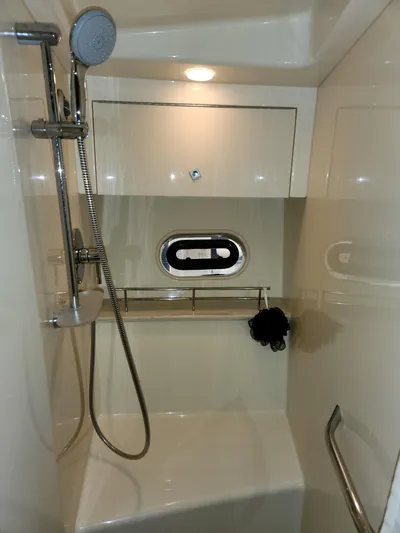 Moonwake Yacht Photos Pics Shower area in 2014 Sea Ray 470 Sundancer yacht with modern fixtures and porthole.