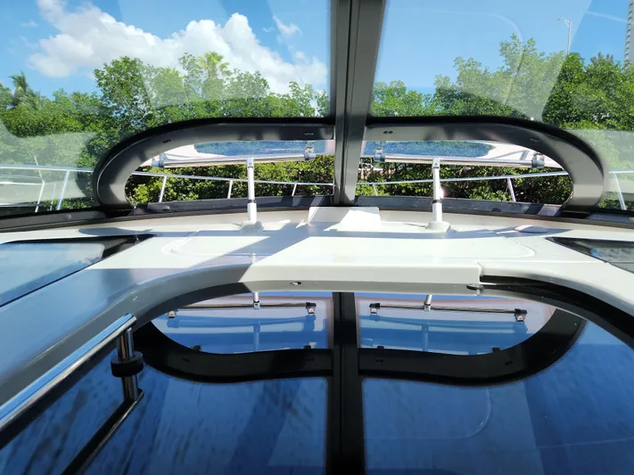 Moonwake Yacht Photos Pics 2014 Sea Ray 470 Sundancer yacht interior with panoramic sunroof and lush greenery outside.