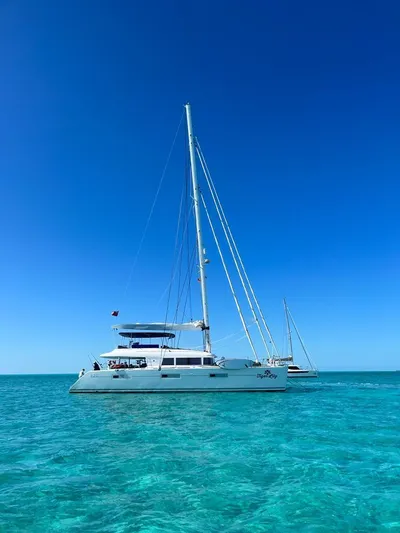 Tiger Lily Yacht Photos Pics Lagoon 620 catamaran sailing in clear turquoise waters, 2015 model.