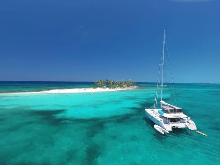 Tiger Lily Yacht Photos Pics Lagoon 620 catamaran anchored near a tropical island, 2015 model.