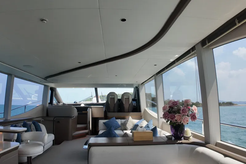 La Mer Yacht Photos Pics Luxurious interior of 2023 Princess Y72 yacht with elegant seating and ocean view.