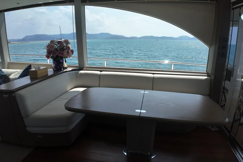 La Mer Yacht Photos Pics Luxurious interior of 2023 Princess Y72 yacht with ocean view and elegant seating area.