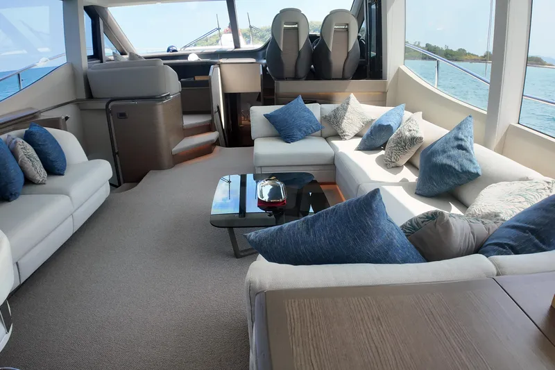La Mer Yacht Photos Pics Luxurious interior of 2023 Princess Y72 yacht with plush seating and ocean view.