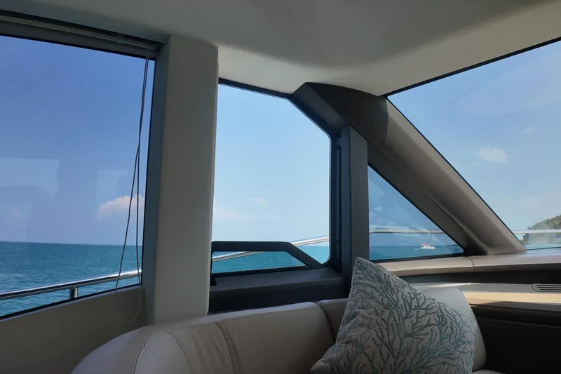 La Mer Yacht Photos Pics Interior view of 2023 Princess Y72 yacht, showcasing ocean through large windows.