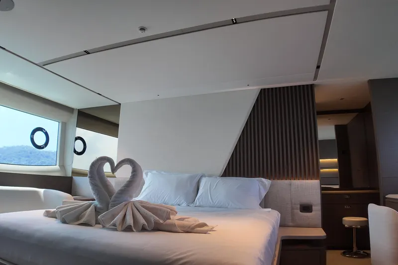 La Mer Yacht Photos Pics Luxurious bedroom interior on 2023 Princess Y72 yacht with elegant towel swans.