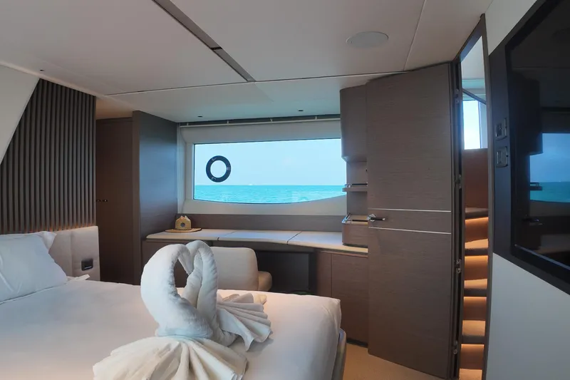 La Mer Yacht Photos Pics Luxurious 2023 Princess Y72 yacht cabin with ocean view and elegant decor.