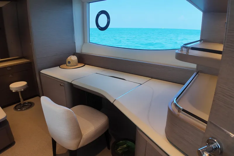 La Mer Yacht Photos Pics Luxurious interior of 2023 Princess Y72 yacht with ocean view window.