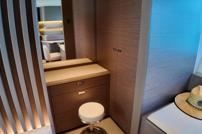 La Mer Yacht Photos Pics Luxurious interior of 2023 Princess Y72 yacht with modern wood finish and seating.