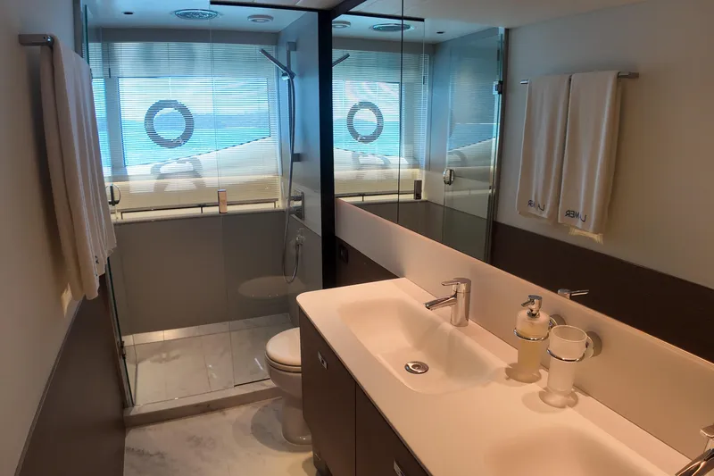 La Mer Yacht Photos Pics Luxurious bathroom in 2023 Princess Y72 yacht with modern fixtures and ocean view.