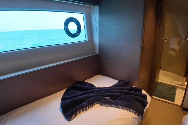 La Mer Yacht Photos Pics Luxurious cabin interior of 2023 Princess Y72 yacht with ocean view.