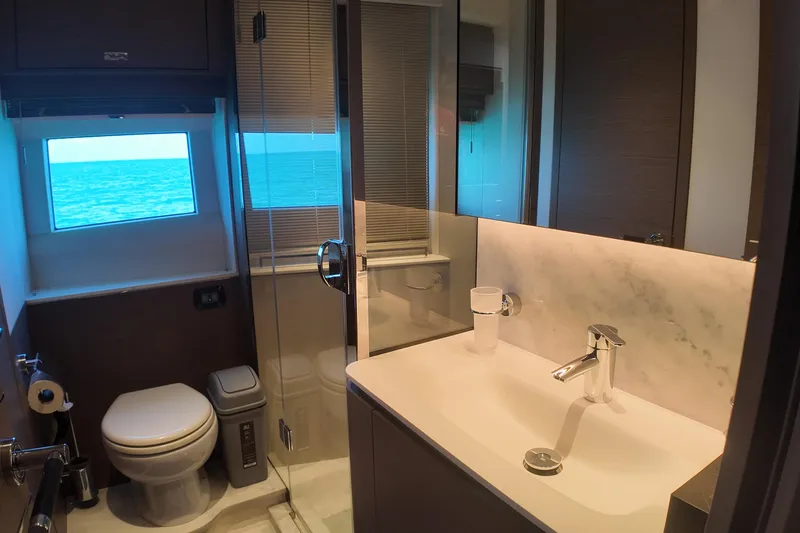 La Mer Yacht Photos Pics Luxurious bathroom on 2023 Princess Y72 yacht with ocean view window.