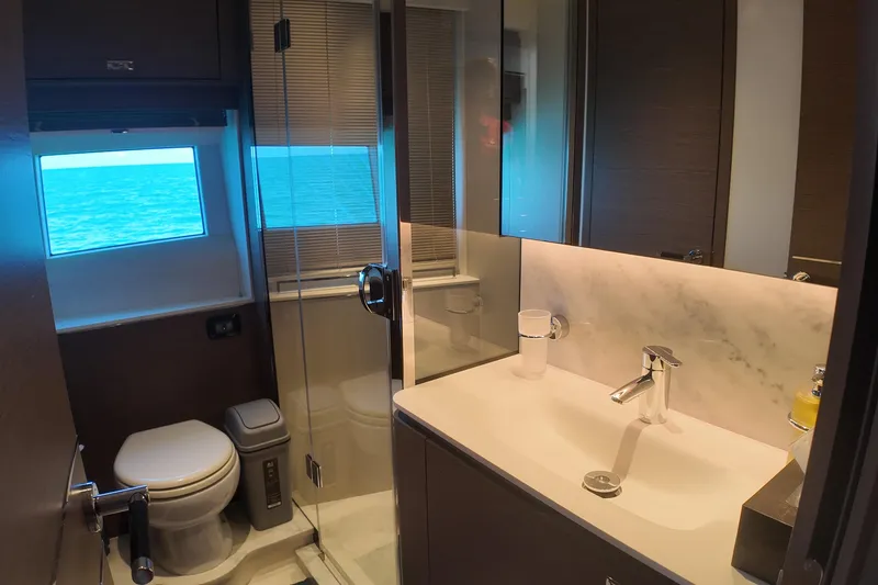 La Mer Yacht Photos Pics Luxurious bathroom on 2023 Princess Y72 yacht with ocean view window.