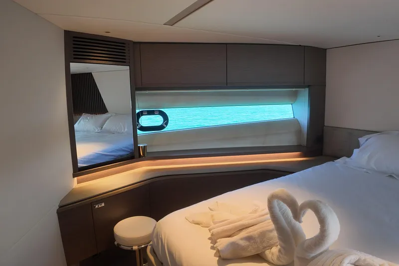La Mer Yacht Photos Pics Luxurious 2023 Princess Y72 yacht bedroom with ocean view and elegant decor.