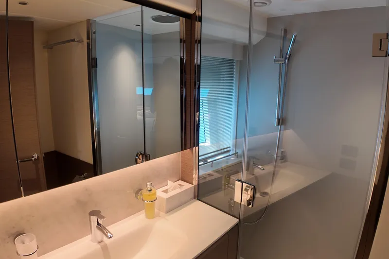 La Mer Yacht Photos Pics Luxurious bathroom in 2023 Princess Y72 yacht with modern fixtures and glass shower.