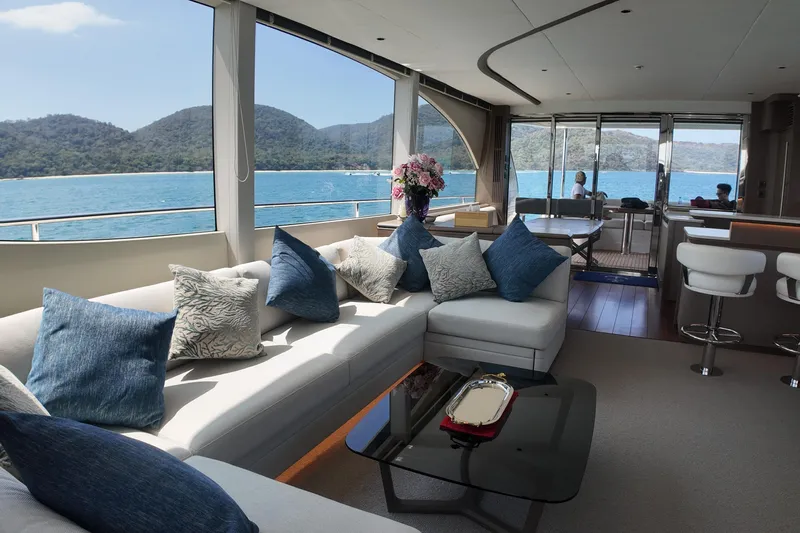 La Mer Yacht Photos Pics Luxurious interior of 2023 Princess Y72 yacht with ocean view and elegant seating.
