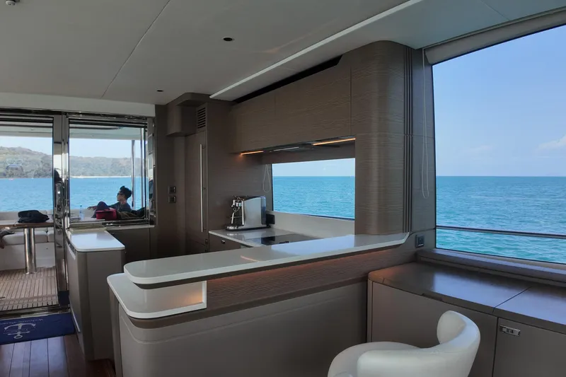 La Mer Yacht Photos Pics Luxurious interior of 2023 Princess Y72 yacht with ocean view and modern kitchen.
