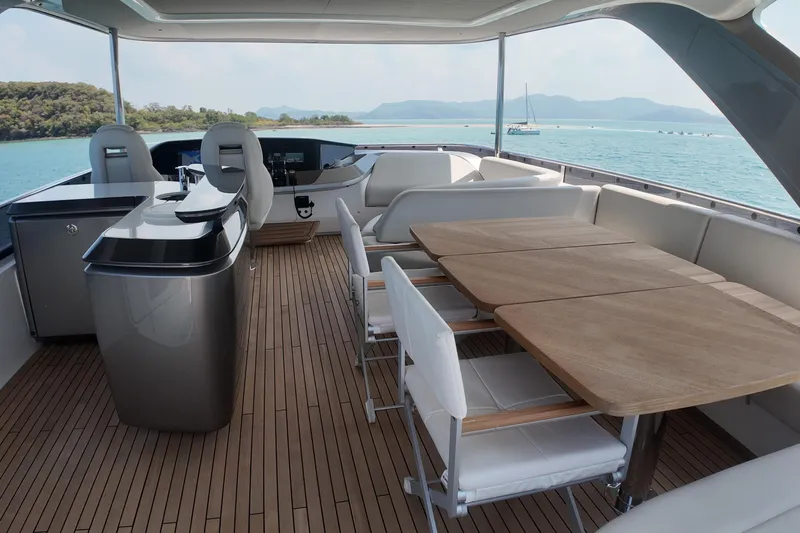La Mer Yacht Photos Pics Luxurious 2023 Princess Y72 yacht deck with elegant seating and scenic ocean view.