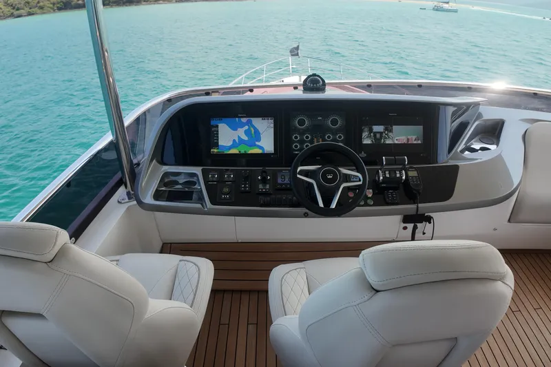La Mer Yacht Photos Pics Luxurious 2023 Princess Y72 yacht helm with advanced navigation system and plush seating.