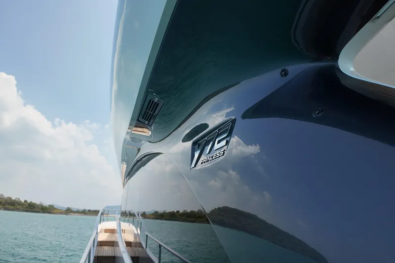 La Mer Yacht Photos Pics 2023 Princess Y72 yacht on serene water, showcasing sleek design and luxury.