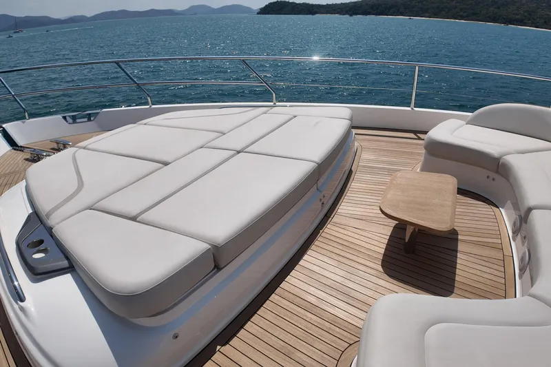 La Mer Yacht Photos Pics Luxurious 2023 Princess Y72 yacht deck with elegant seating and ocean view.