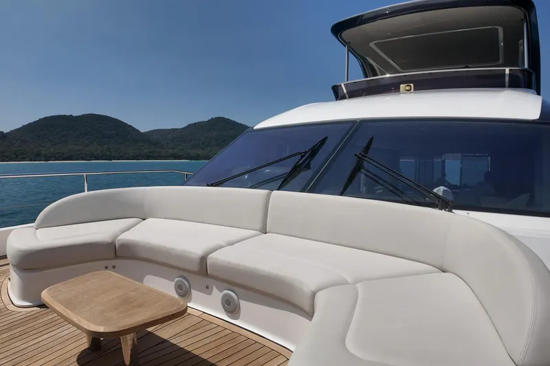 La Mer Yacht Photos Pics Luxurious 2023 Princess Y72 yacht deck with elegant seating and scenic ocean view.