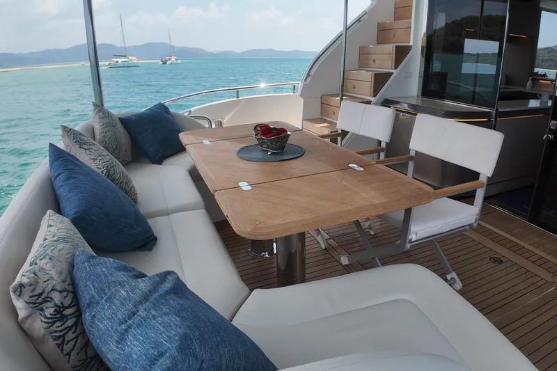 La Mer Yacht Photos Pics Luxurious 2023 Princess Y72 yacht deck with elegant seating and ocean view.