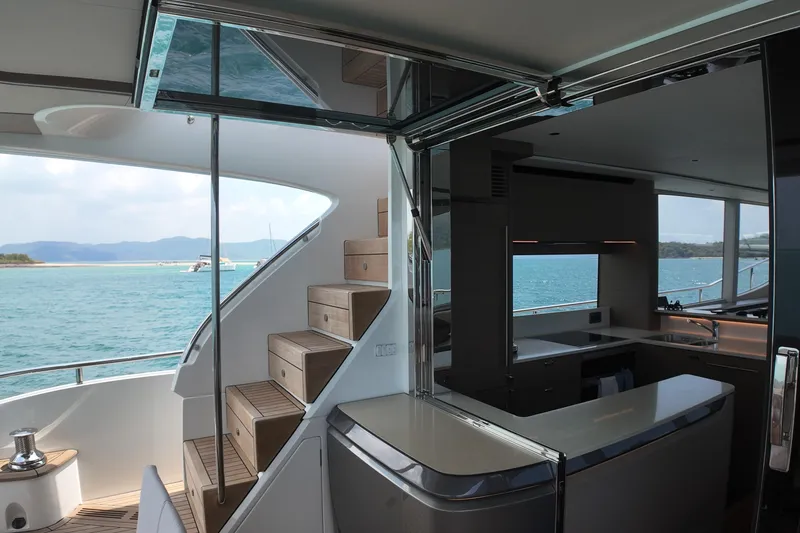 La Mer Yacht Photos Pics Luxurious interior of 2023 Princess Y72 yacht with ocean view and modern kitchen.