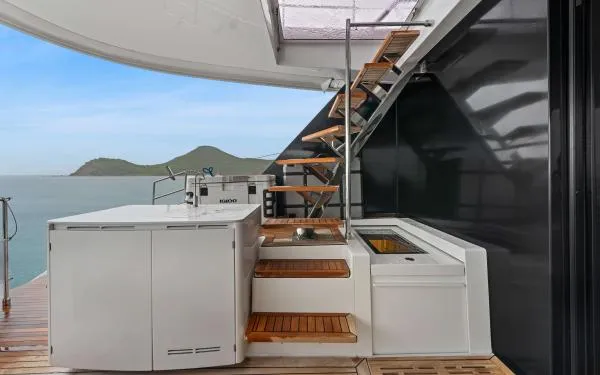 Ocean Vibes Yacht Photos Pics Luxury Sunreef 70 yacht deck with modern staircase and ocean view, 2020 model.