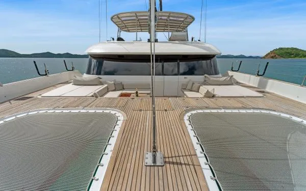 Ocean Vibes Yacht Photos Pics Luxurious 2020 Sunreef 70 yacht deck with spacious lounging area and scenic ocean view.