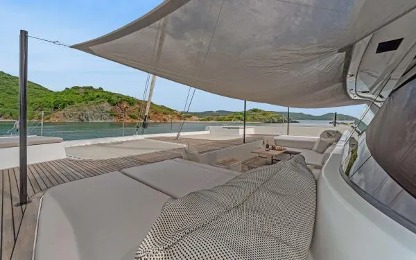 Ocean Vibes Yacht Photos Pics Luxurious Sunreef 70 yacht deck with comfortable seating, scenic ocean view, and modern design.