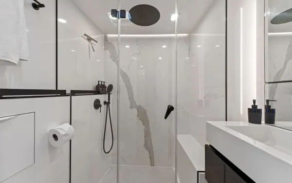 Ocean Vibes Yacht Photos Pics Luxurious bathroom in a 2020 Sunreef 70 yacht, featuring modern fixtures and elegant design.