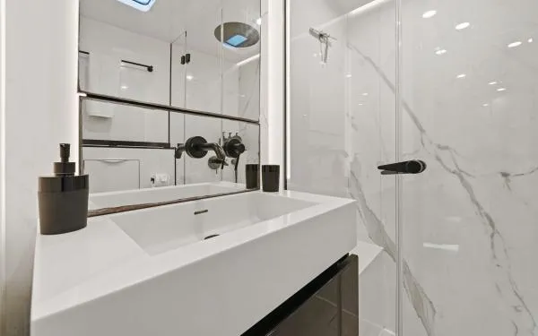 Ocean Vibes Yacht Photos Pics Modern bathroom in 2020 Sunreef 70 yacht with sleek fixtures and marble accents.