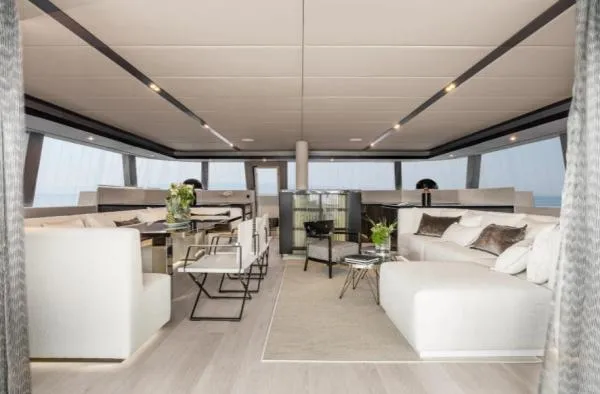 Ocean Vibes Yacht Photos Pics Luxurious interior of 2020 Sunreef 70 yacht with modern furnishings and elegant decor.