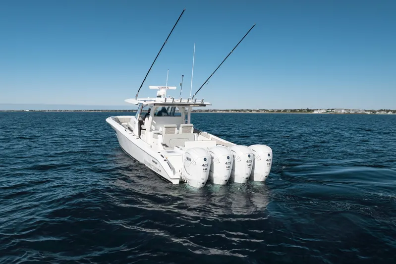 Moore Time Yacht Photos Pics 2023 Pursuit S 428 Sport boat with four engines on open water.