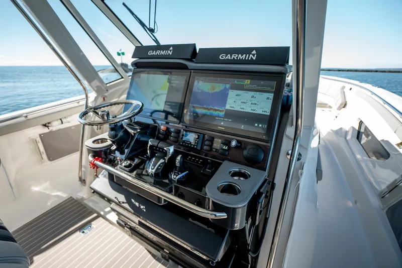 Moore Time Yacht Photos Pics 2023 Pursuit S 428 Sport boat helm with Garmin navigation system.