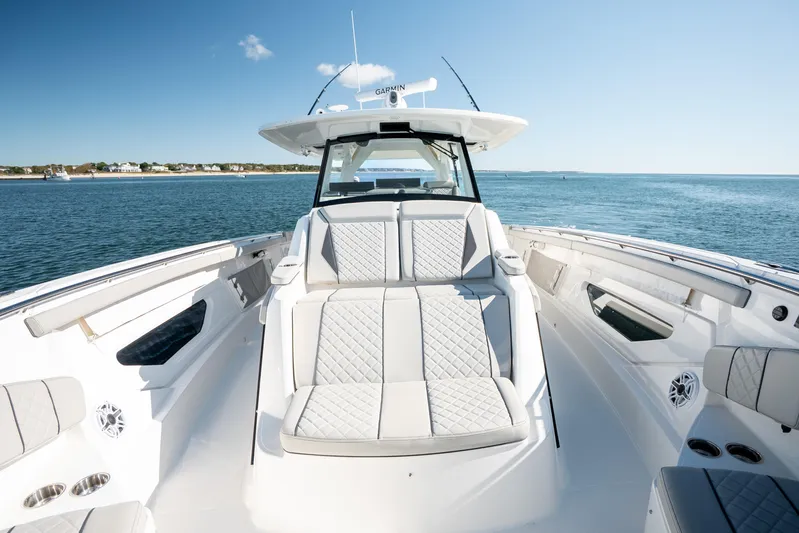 Moore Time Yacht Photos Pics 2023 Pursuit S 428 Sport boat with luxurious seating on open water.
