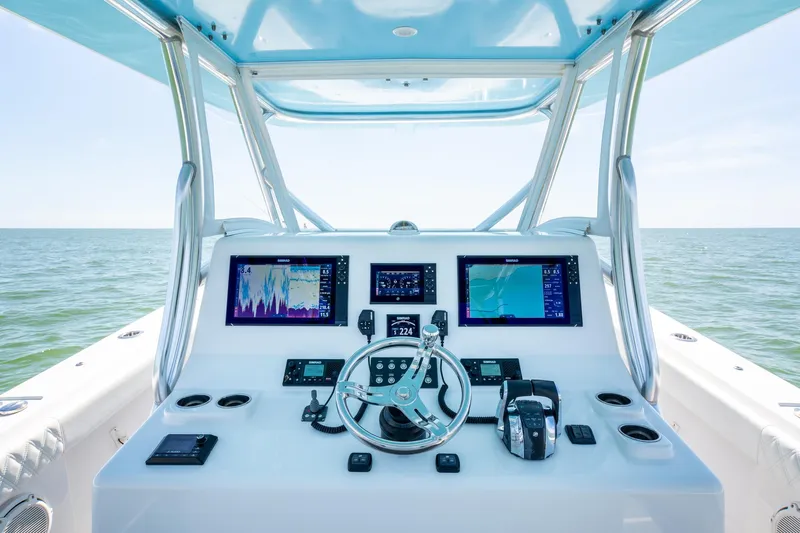  Yacht Photos Pics 2020 Front Runner 39 Center Console boat dashboard with navigation screens and steering wheel.