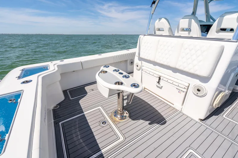  Yacht Photos Pics 2020 Front Runner 39 Center Console boat interior with seating and rod holders on a sunny day.