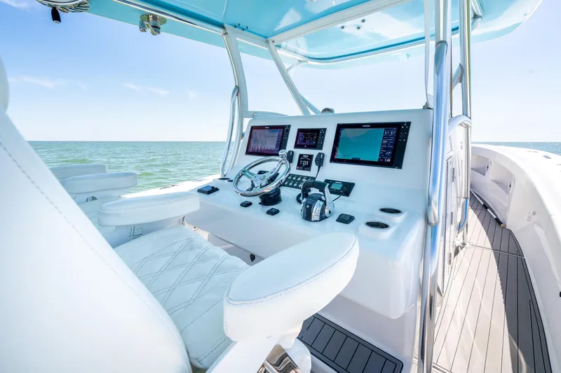  Yacht Photos Pics 2020 Front Runner 39 Center Console boat interior with modern navigation equipment and ocean view.