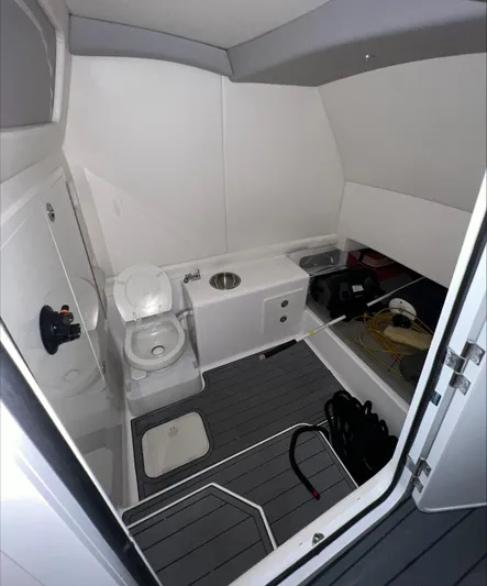  Yacht Photos Pics 2020 Front Runner 39 Center Console boat interior with toilet and storage area.