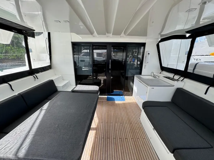 Promprang Yacht Photos Pics Spacious interior of 2020 Lagoon 50 catamaran with modern seating and sleek design.