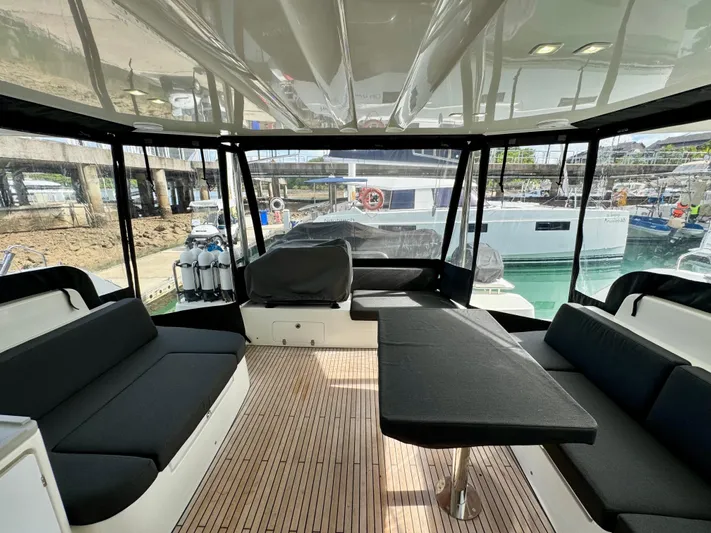 Promprang Yacht Photos Pics Spacious interior of 2020 Lagoon 50 catamaran with modern seating and wooden flooring.